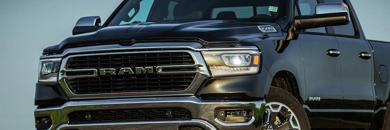 EGR hood guard installed on a black RAM truck